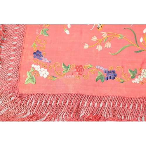 882 - TWO CHINESE SILK EMBROIDERED SHAWLS. Two large Chinese shawls, including a large pink silk shawl, he... 