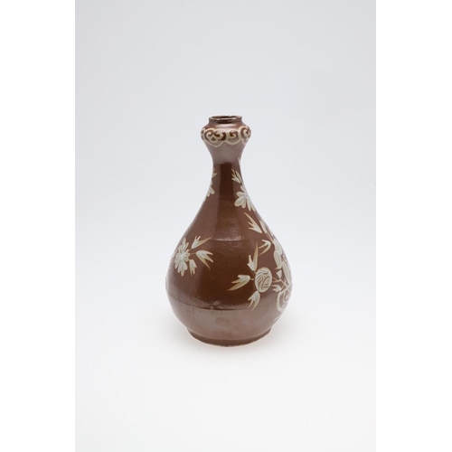 888 - CHINESE BOTTLE SHAPED VASE WITH WHITE SLIP - 16TH/17TH CENTURY. Late Ming circa 16th/17thc, the porc... 