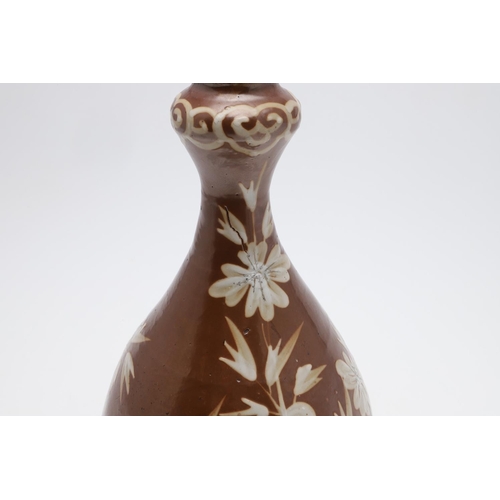 888 - CHINESE BOTTLE SHAPED VASE WITH WHITE SLIP - 16TH/17TH CENTURY. Late Ming circa 16th/17thc, the porc... 