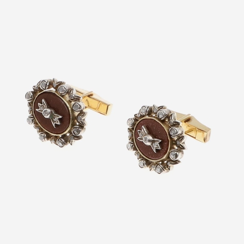 1039 - A PAIR OF DIAMOND AND GOLDSTONE CUFFLINKS. each cufflink set with an oval section of goldstone with ... 