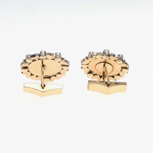 1039 - A PAIR OF DIAMOND AND GOLDSTONE CUFFLINKS. each cufflink set with an oval section of goldstone with ... 