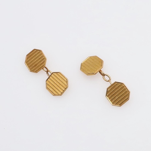 1040 - A PAIR OF 18CT GOLD CUFFLINKS. each link of octagonal-shape with engine turned decoration, 8.5 grams... 