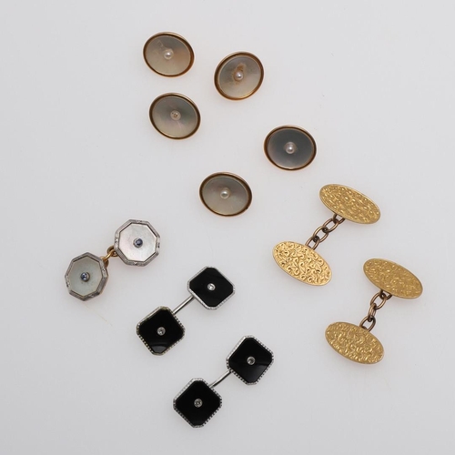 1041 - A PAIR OF BLACK ONYX AND DIAMOND CUFFLINKS. each octagonal-shaped black onyx link centred with a sin... 