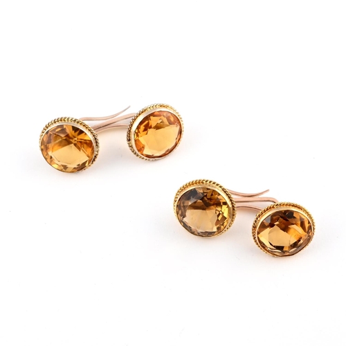 1042 - A PAIR OF CITRINE & GOLD CUFFLINKS. each link mounted with a circular-cut citrine, in gold mounts.  ... 