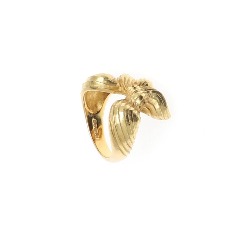 1058 - AN 18CT GOLD BOW RING. with ridged decoration, hallmarked for London 1970, 14.5 grams. Size M 1/2.  ... 