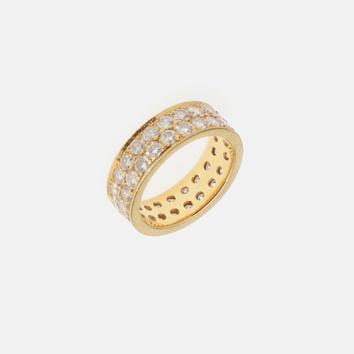 1061 - A DIAMOND FULL CIRCLE ETERNITY RING. mounted with two rows of brilliant-cut diamonds, in yellow gold... 