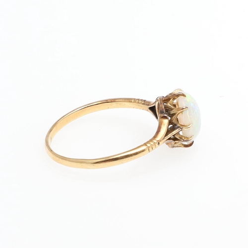 1064 - AN OPAL HEART-SHAPED SINGLE STONE RING. mounted with a heart-shaped solid white opal, in yellow gold... 