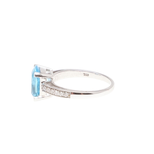 1071 - A BLUE TOPAZ AND DIAMOND RING. the rounded rectangular-shaped blue topaz is set with circular-cut di... 