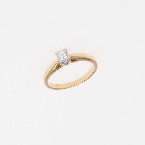 1073 - A DIAMOND SOLITAIRE RING. the rectangular-shaped diamond is set in 18ct gold, 2.4 grams. Size I 1/2.... 