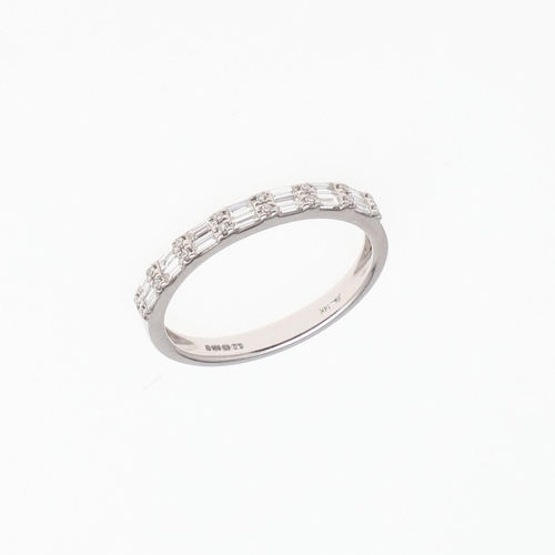 1075 - A DIAMOND HALF HOOP RING. mounted alternately with pairs of baguette-cut and circular-cut diamonds, ... 