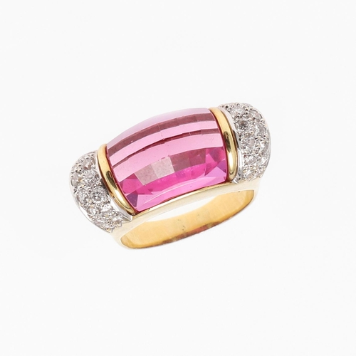 1276 - A SYNTHETIC PINK SAPPHIRE AND DIAMOND RING. the faceted synthetic pink sapphire is set with two rows... 