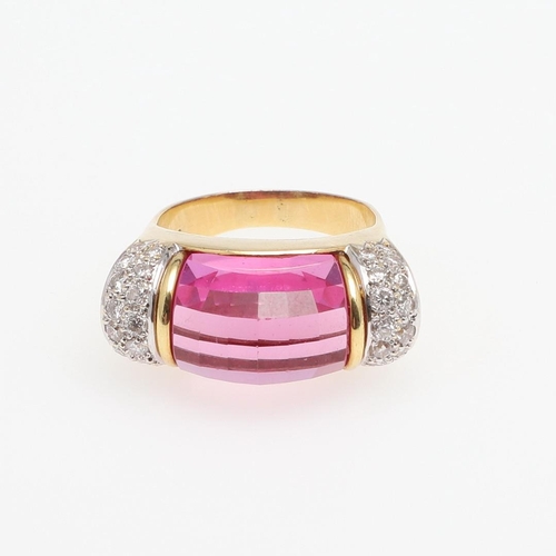 1276 - A SYNTHETIC PINK SAPPHIRE AND DIAMOND RING. the faceted synthetic pink sapphire is set with two rows... 