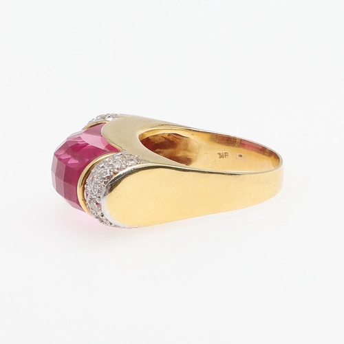 1276 - A SYNTHETIC PINK SAPPHIRE AND DIAMOND RING. the faceted synthetic pink sapphire is set with two rows... 