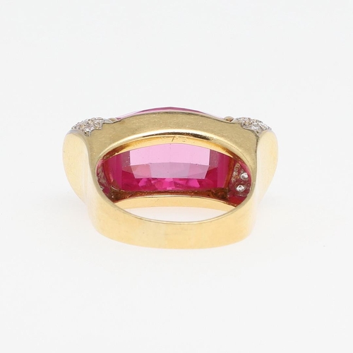 1276 - A SYNTHETIC PINK SAPPHIRE AND DIAMOND RING. the faceted synthetic pink sapphire is set with two rows... 