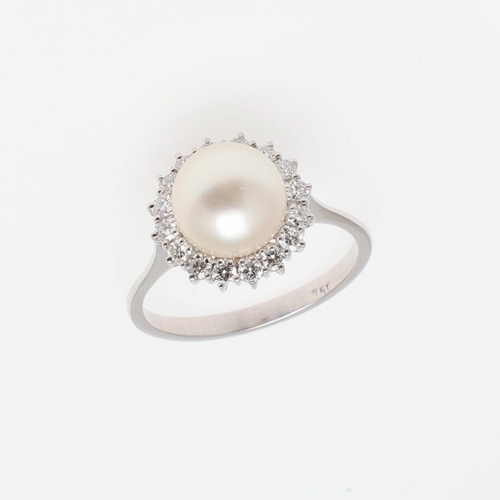 1277 - A CULTURED PEARL AND DIAMOND CLUSTER RING. the cultured pearl measures approximately 9.2mm and is se... 