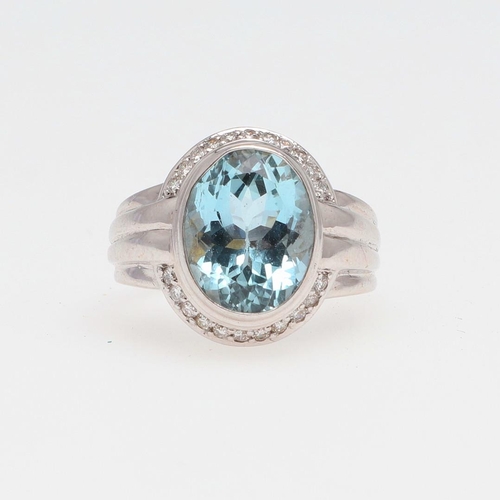 1278 - AN AQUAMARINE AND DIAMOND CLUSTER RING. the oval-shaped aquamarine is set within a surround of circu... 