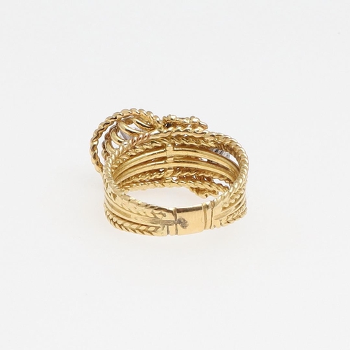 1279 - A DIAMOND AND GOLD RING. of woven gold knotted design, set with two brilliant-cut diamonds, 7.9 gram... 