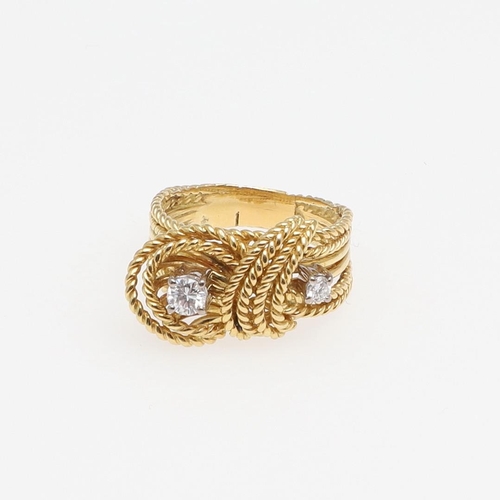 1279 - A DIAMOND AND GOLD RING. of woven gold knotted design, set with two brilliant-cut diamonds, 7.9 gram... 