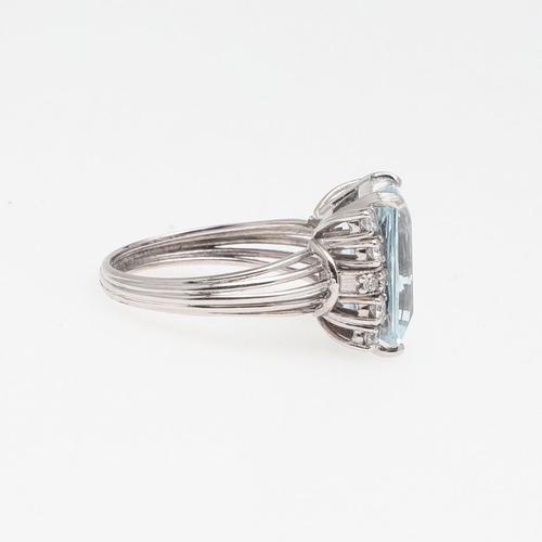 1280 - AN AQUAMRINE AND DIAMOND RING. the rectangular-shaped aquamarine is set with six circular-cut diamon... 