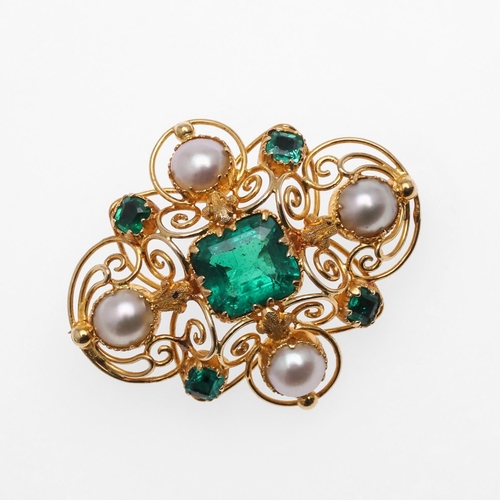 1282 - AN EMERALD, PEARL AND GOLD BROOCH. the gold openwork mount is centred with a rectangular-shaped emer... 