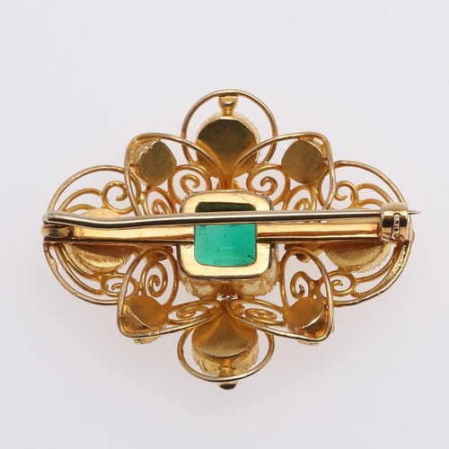 1282 - AN EMERALD, PEARL AND GOLD BROOCH. the gold openwork mount is centred with a rectangular-shaped emer... 