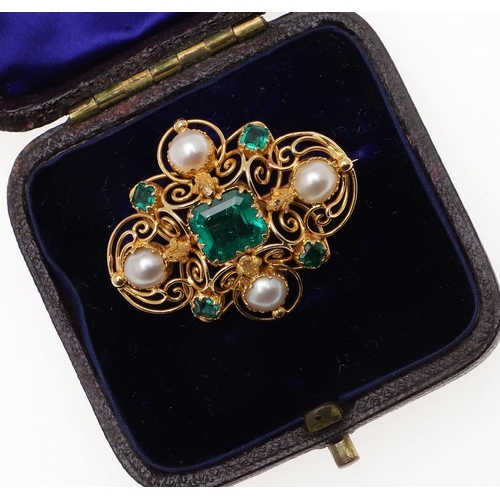 1282 - AN EMERALD, PEARL AND GOLD BROOCH. the gold openwork mount is centred with a rectangular-shaped emer... 