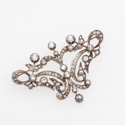 1283 - A VICTORIAN DIAMOND BROOCH. of openwork foliate scrolling design, set overall with graduated old-cut... 