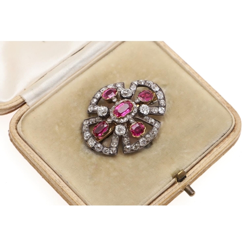 1284 - A VICTORIAN RUBY AND DIAMOND BROOCH PENDANT. mounted with oval-shaped rubies and overall with gradua... 