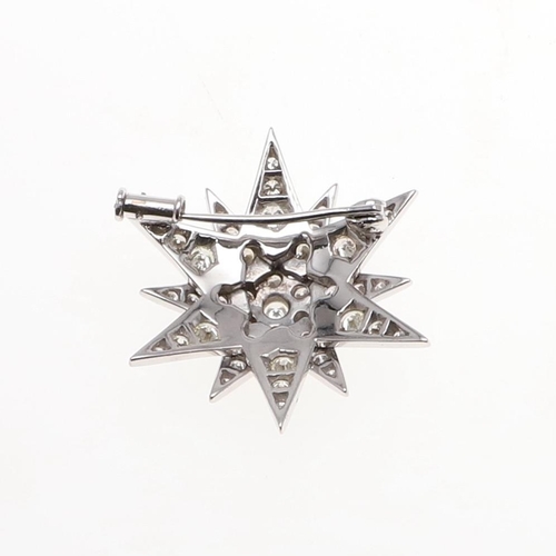 1285 - A DIAMOND STAR BROOCH. mounted overall with graduated circular-cut diamonds in white gold, 3.5cm wid... 