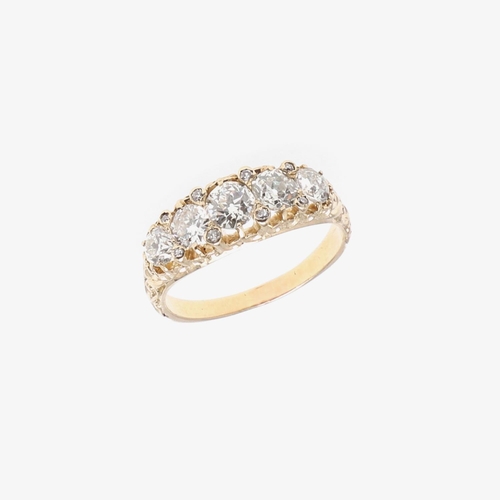 1292 - AN EDWARDIAN DIAMOND FIVE STONE RING. mounted with five graduated round old-cut diamonds weighing ap... 