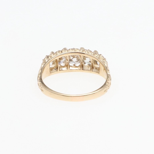 1292 - AN EDWARDIAN DIAMOND FIVE STONE RING. mounted with five graduated round old-cut diamonds weighing ap... 