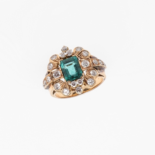 1295 - A COLUMBIAN EMERALD AND DIAMOND CLUSTER RING. the rectangular-shaped emerald is set within a surroun... 