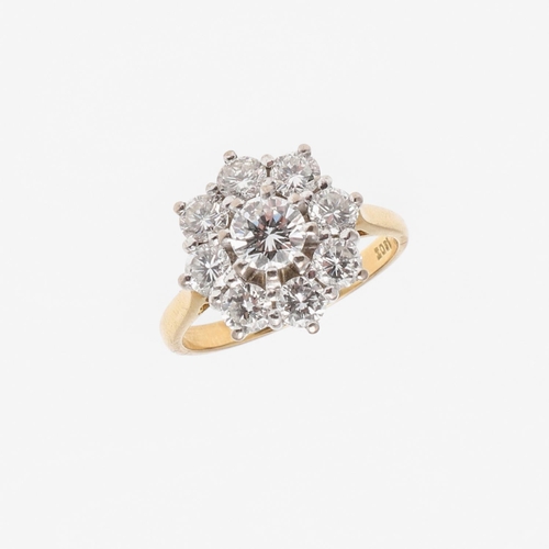 1297 - A DIAMOND CLUSTER RING. the central brilliant-cut diamond is set within a surround of eight smaller ... 