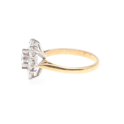 1297 - A DIAMOND CLUSTER RING. the central brilliant-cut diamond is set within a surround of eight smaller ... 