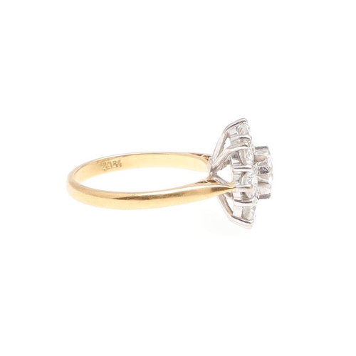 1297 - A DIAMOND CLUSTER RING. the central brilliant-cut diamond is set within a surround of eight smaller ... 