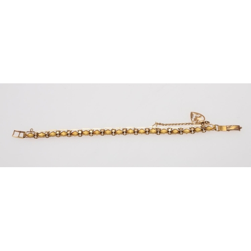 914 - A GOLD FANCY LINK BRACELET. 18cm long, 19.4 grams, together with a gold cocktail ring, 9.4 grams, si... 