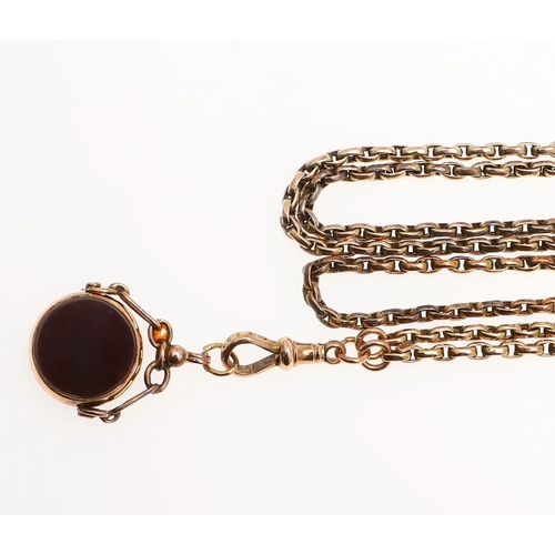 933 - A 9CT GOLD LONG GUARD CHAIN. formed with oval-shaped links, suspending a 9ct gold spinning fob mount... 