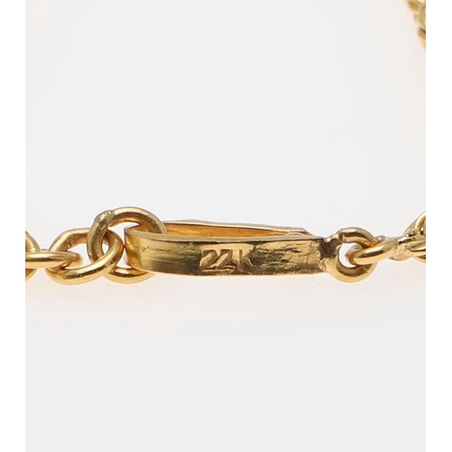 935 - A GOLD ROPE LINK NECKLACE. with a hook clasp, 45.5cm long, 23.3 grams, together with a conforming br... 