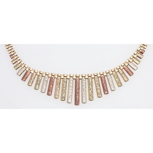 945 - A 9CT THREE COLOUR GOLD FRINGE NECKLACE. formed with graduated three gold textured baton drops, 48cm... 