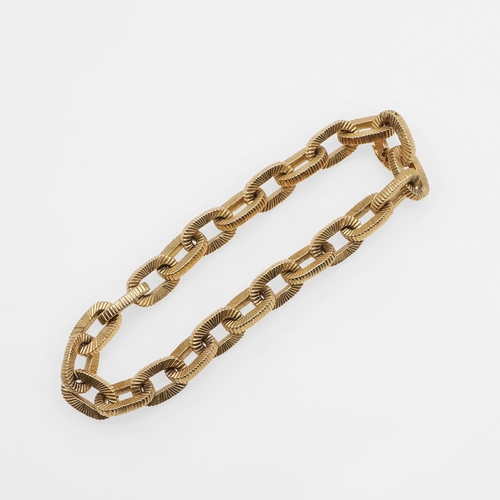 946 - AN 18CT GOLD BRACELET. formed with oval-shaped textured links, 19.5cm long, 44.4 grams.  *CR  Some w... 