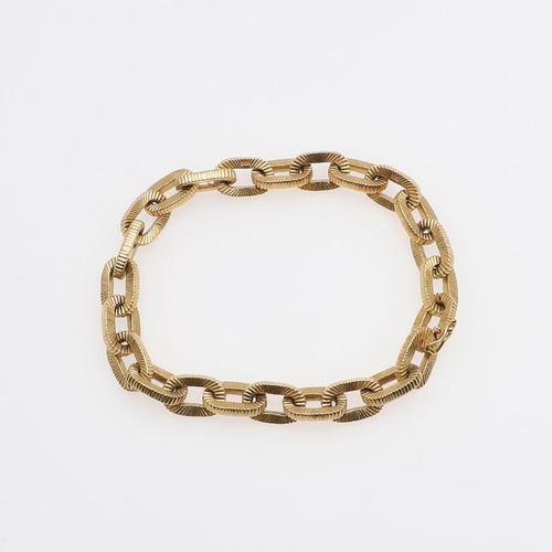 946 - AN 18CT GOLD BRACELET. formed with oval-shaped textured links, 19.5cm long, 44.4 grams.  *CR  Some w... 