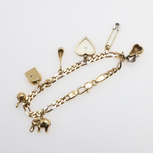 957 - AN 18CT GOLD FLAT CURB LINK BRACELET. formed with long and short links, suspending assorted gold cha... 