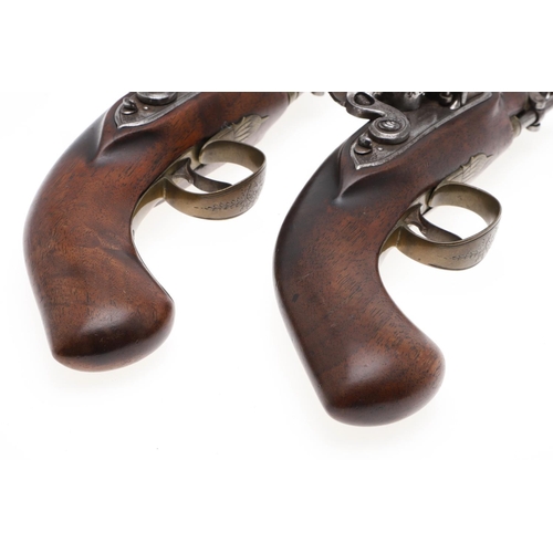 1 - A FINE PAIR OF IRISH FLINTLOCK RIGBY STYLE 10 BORE PISTOLS BY BRANDER & POTTS. A fine pair of pistol... 