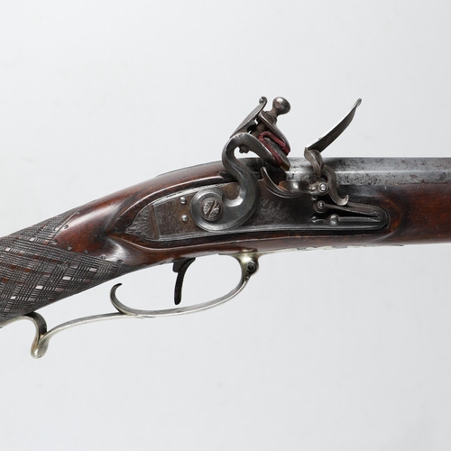 11 - A 24 BORE FLINTLOCK RIFLE BY EVANS OF CARMARTHEN. With a heavy 70.5cm octagonal barrel with folding ... 