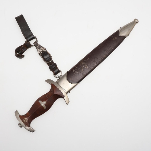 116 - A SECOND WORLD WAR GERMAN SA DAGGER AND SCABBARD. With a 22cm pointed, double edged blade inscribed ... 