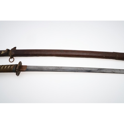 121 - A JAPANESE KATANA IN LACQUERED SCABBARD. MID 20TH CENTURY. A Second World War Japanese Officers Swor... 