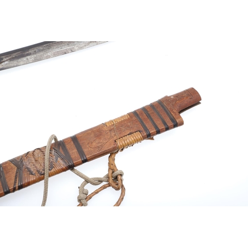 127 - A BORNEO DYACK SWORD AND SCABBARD AND A SIMILAR KNIFE AND SHEATH. A Dyack 'Headhunters' sword with a... 