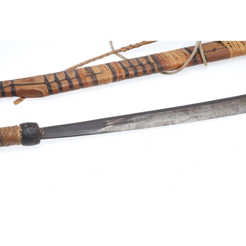 127 - A BORNEO DYACK SWORD AND SCABBARD AND A SIMILAR KNIFE AND SHEATH. A Dyack 'Headhunters' sword with a... 