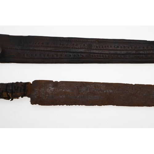 128 - AN AFRICAN LONG-BLADED KNIFE AND LEATHER COVERED SCABBARD. With a 41cm pointed tapering blade with a... 