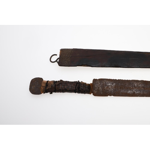 128 - AN AFRICAN LONG-BLADED KNIFE AND LEATHER COVERED SCABBARD. With a 41cm pointed tapering blade with a... 